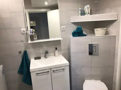 a small bathroom with a sink and a toilet at La Fontana in Belgrade