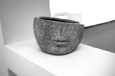 a black vase sitting on a white shelf at ForS Resort & Spa in Belgrade