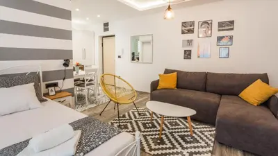 a living room with a couch and a table at Casablanca apartment in Belgrade