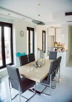a dining room with a table and chairs at LION NEST in Belgrade