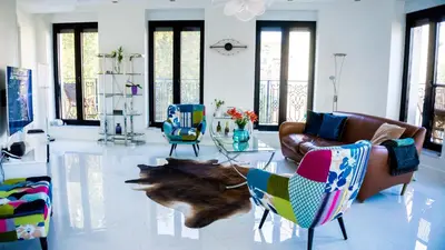 a living room with couches and a table and chairs at LION NEST in Belgrade