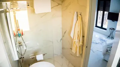 a bathroom with a toilet and a sink at LION NEST in Belgrade