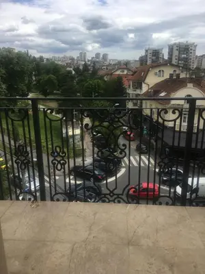 a balcony with a view of a parking lot at LION NEST in Belgrade