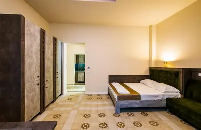 a bedroom with a bed and a couch at Lux Villa Old Town in Belgrade