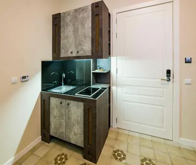 a kitchen with a sink next to a door at Lux Villa Old Town in Belgrade
