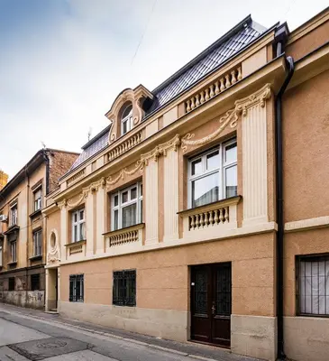a large building on a city street at Lux Villa Old Town in Belgrade