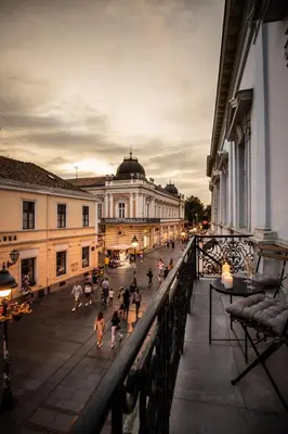 a group of people walking down a city street at Maison Royale in Belgrade