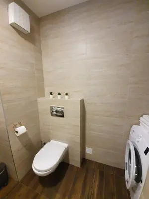 a small bathroom with a toilet and a sink at NIKLUK in Belgrade