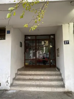 a door to a building with stairs in front at Apartment Jasna in Belgrade