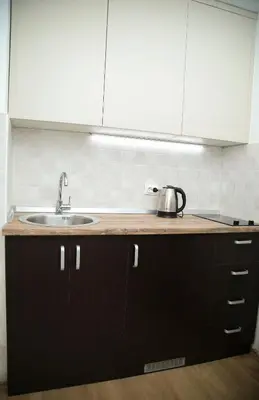a kitchen with a sink and a counter top at Havana Beograd Apartment in Belgrade
