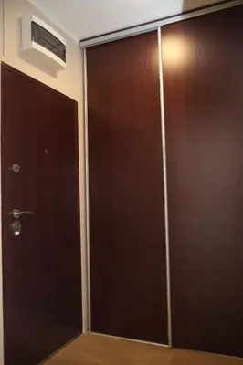 a pair of sliding doors in a room at Havana Beograd Apartment in Belgrade
