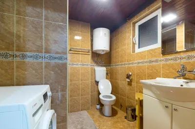 a bathroom with a toilet and a sink at Belgrade Center Apartment V in Belgrade