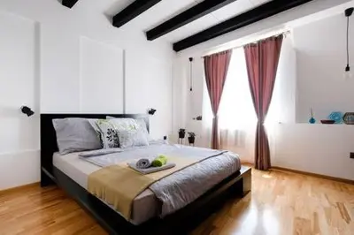 a bedroom with a bed with a tray of fruit on it at Svetogorska tri in Belgrade
