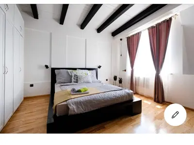 a bedroom with a bed and a large window at Svetogorska tri in Belgrade