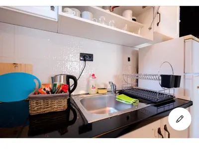 a small kitchen with a sink and a counter top at Svetogorska tri in Belgrade