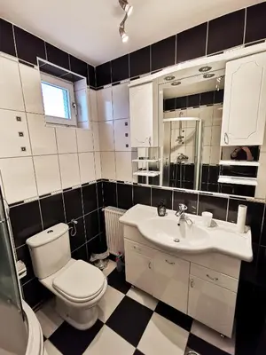 a bathroom with a toilet and a sink at Apartman White in Belgrade
