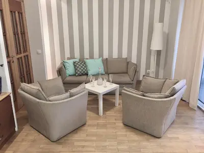 a living room with two chairs and a table at Knez Mihailova, Beograd in Belgrade