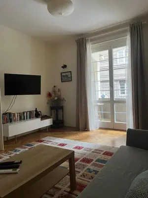 a living room with a flat screen tv on the wall at Apartment No1 in Belgrade