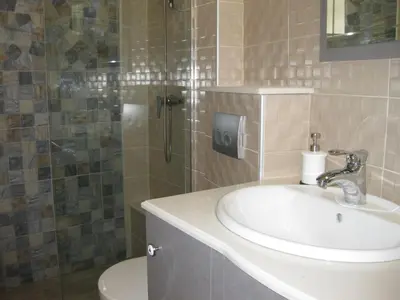 a bathroom with a sink and a shower at Apartment No1 in Belgrade