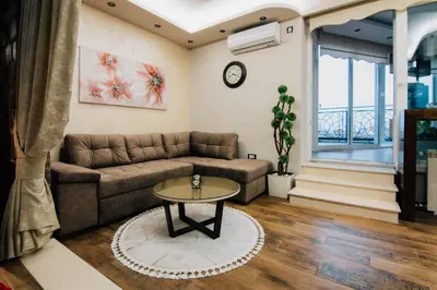 a living room with a couch and a table at President Lux in Belgrade