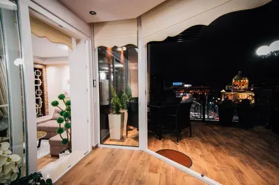 a room with a mirror on the floor and a table at President Lux in Belgrade