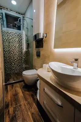a bathroom with a sink and a toilet and a shower at President Lux in Belgrade