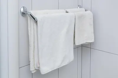 a group of towels hanging on a towel rack in a bathroom at SAN 011 in Belgrade