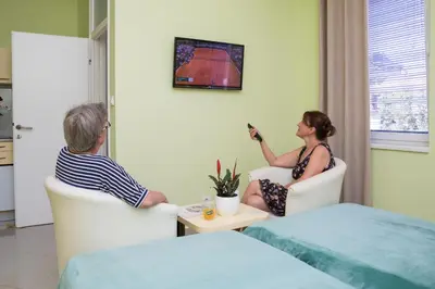a man and a woman sitting in chairs in a room at SAN 011 in Belgrade