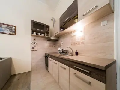 a kitchen with a sink and a counter top at Apartment Ema in Belgrade