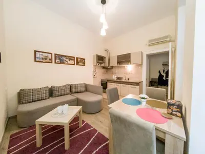 a living room with a couch and a table at Apartment Ema in Belgrade