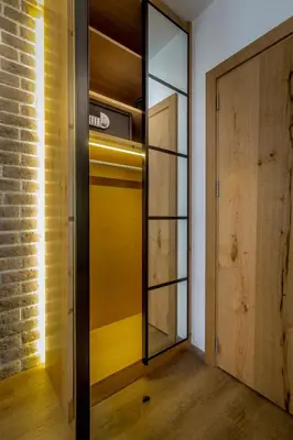 a room with a closet with a glass door at Level Luxury Suites in Belgrade