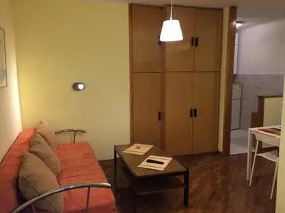 a living room with a couch and a table at Vracar Krunska Jamiva in Belgrade