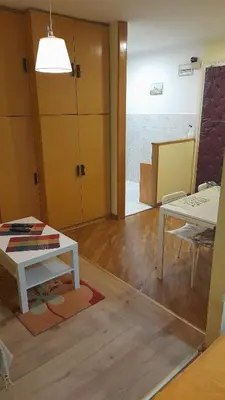 a living room with a table and a dining room at Vracar Krunska Jamiva in Belgrade