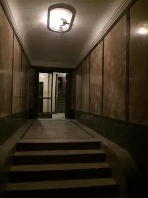 an empty hallway with a staircase in a building at Vracar Krunska Jamiva in Belgrade