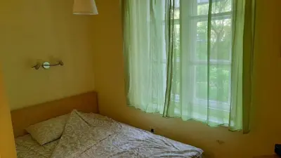a bedroom with a bed in front of a window at Vracar Krunska Jamiva in Belgrade