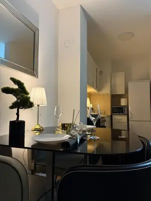 a kitchen with a dining table with a plant on it at Barbara in Belgrade
