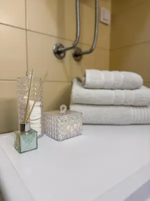 a white counter top with a pile of towels at Barbara in Belgrade