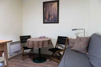 a living room with a table and a couch at House of Vracar in Belgrade