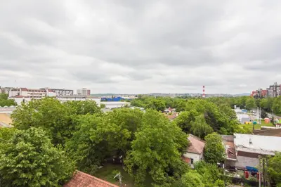 an overhead view of a city with trees and buildings at Beo Green View in Belgrade