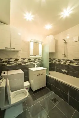 a bathroom with a toilet and a sink and a tub at Free.three in Belgrade