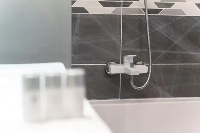 a bathroom with a shower with a faucet at Free.three in Belgrade