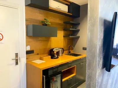 a small kitchen with a counter and a sink at Black Pearl Luxury Suites in Belgrade