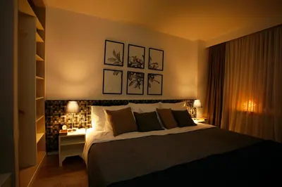 a bedroom with a large bed and a desk with a lamp at BestStay Apartment No 9 Pedestrian zone in Belgrade