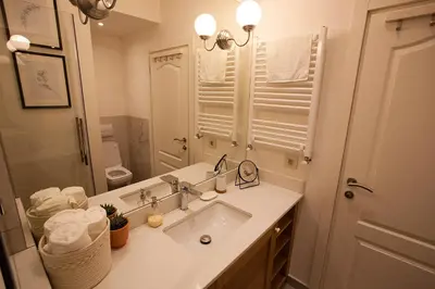 a bathroom with a sink and a mirror at BestStay Apartment No 9 Pedestrian zone in Belgrade