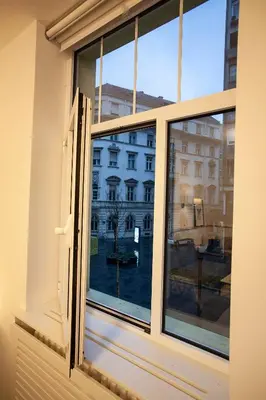 an open window with a view of a building at BestStay Apartment No 9 Pedestrian zone in Belgrade