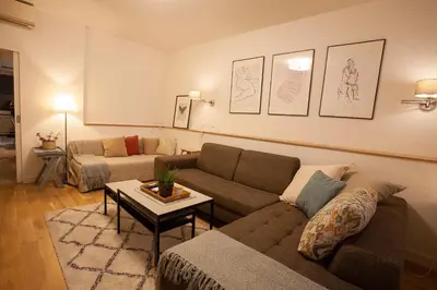 a living room with a couch and a table at BestStay Apartment No 9 Pedestrian zone in Belgrade