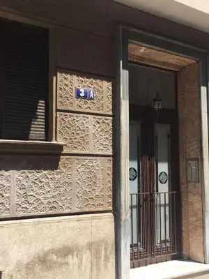 a building with a sign on the side of it at Top Central 5 Apartments in Belgrade