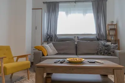 a living room with a couch and a coffee table at Jumi in Belgrade