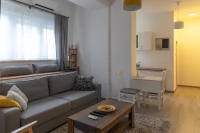 a living room with a couch and a table at Jumi in Belgrade