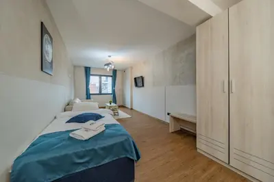 a bedroom with two beds in a room at Hotel Garni VIZURA Sport in Belgrade